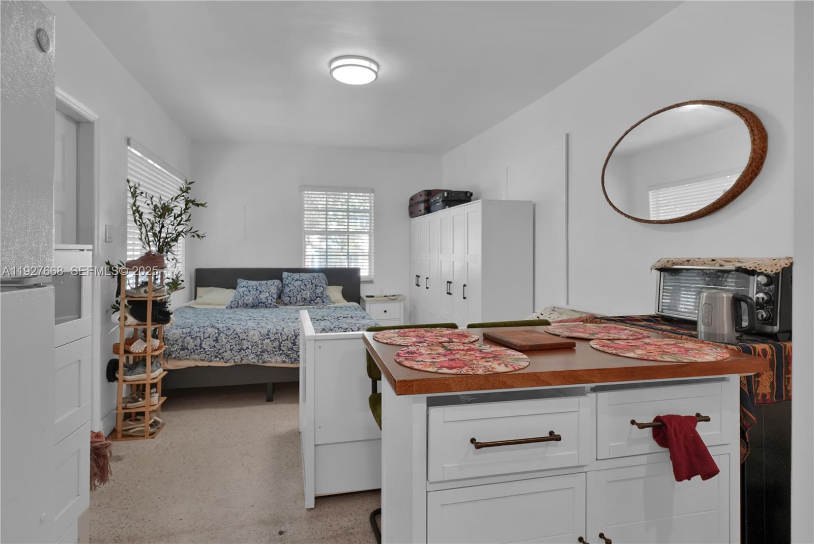 601 Southwest 6th Avenue Miami, FL 33130 - Photo 12 of 20 a bedroom with bed and a mirror