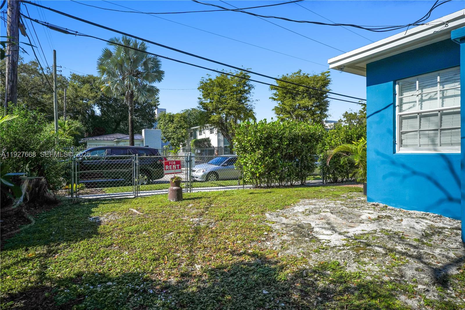 601 Southwest 6th Avenue Miami, FL 33130 - Photo 15 of 20 a view of a backyard with table and chairs and potted plants