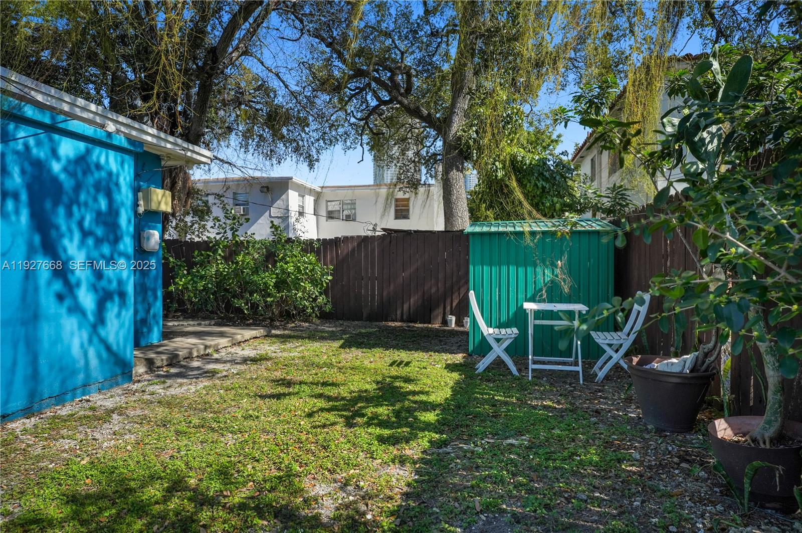 601 Southwest 6th Avenue Miami, FL 33130 - Photo 16 of 20 a view of a chair and table in backyard of the house