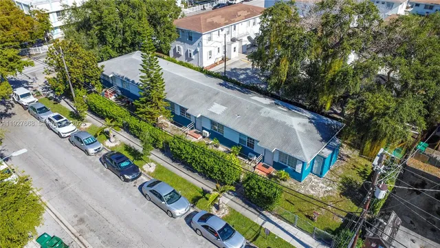 a view of a yard with potted plants