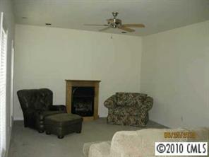 3019 White Store Road Wingate, NC 28174 - Photo 4 of 8 a living room with furniture and a fireplace