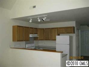 3019 White Store Road Wingate, NC 28174 - Photo 8 of 8 a kitchen with a sink and a refrigerator