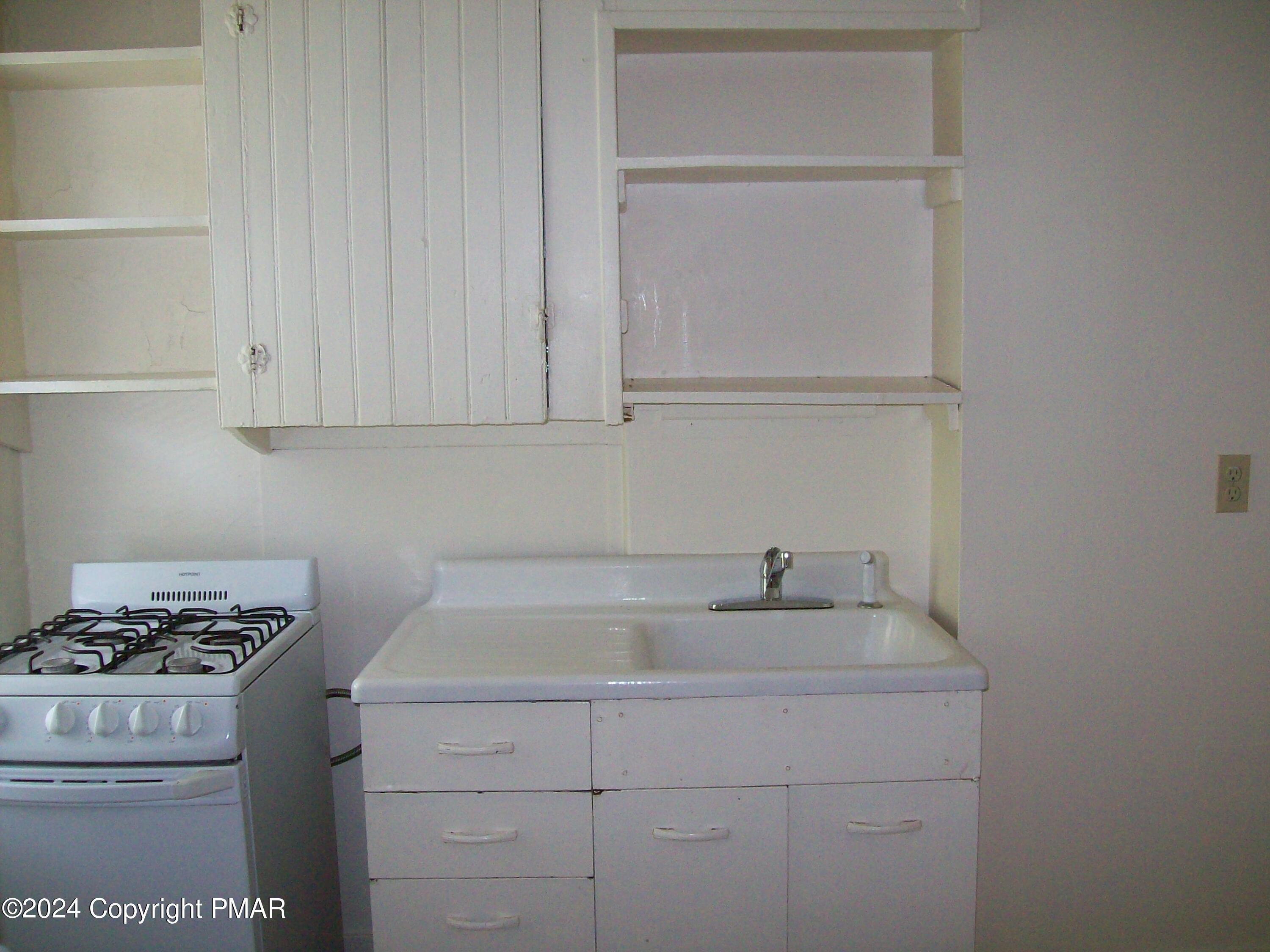 519 Sarah Street, Unit # 11 Stroudsburg, PA 18360 - Photo 3 of 8 a kitchen with a sink cabinets and appliances