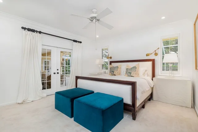 a bedroom with bed and window