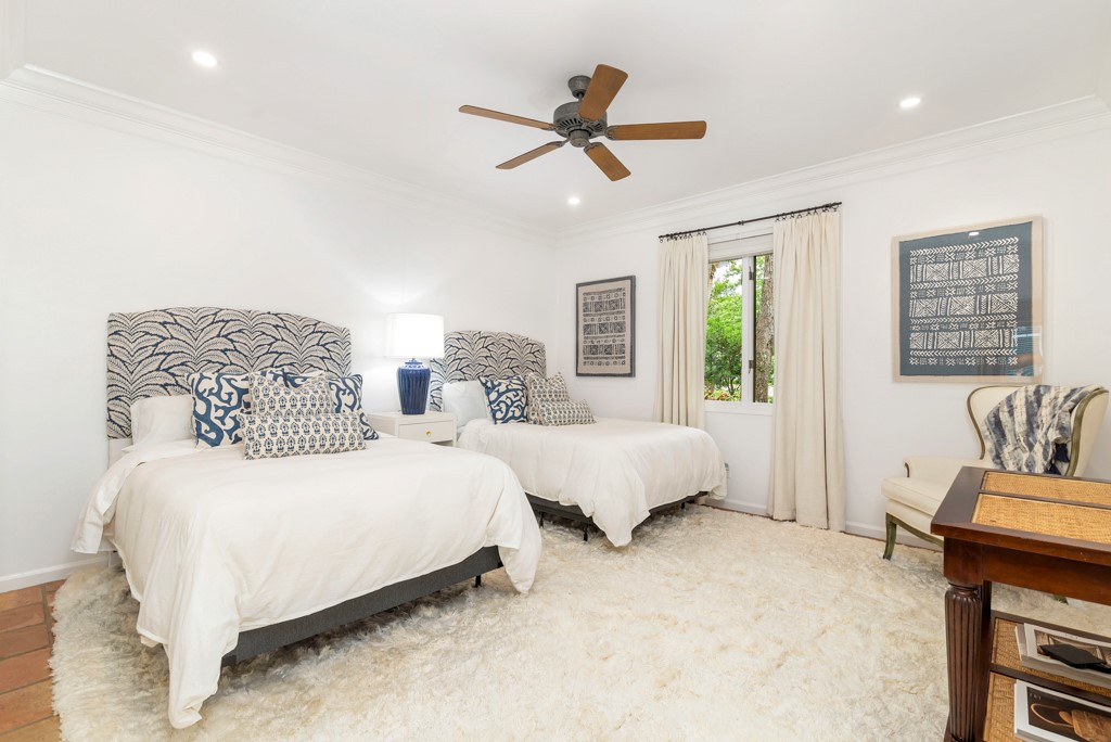 1513 East Camino Del Rio Vero Beach, FL 32963 - Photo 24 of 36 a bedroom with two beds and painting on the wall