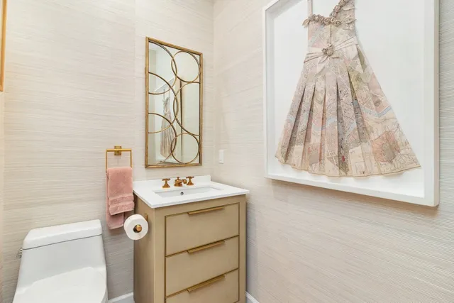 a bathroom with a sink a vanity and a mirror