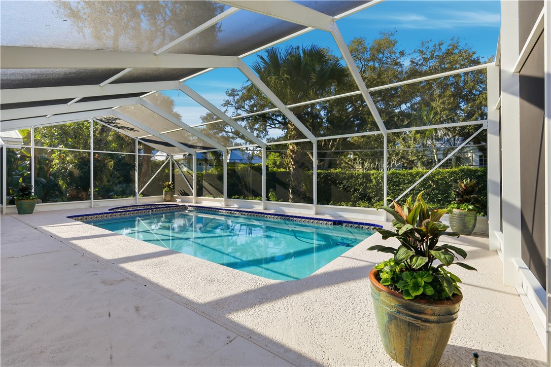 1513 East Camino Del Rio Vero Beach, FL 32963 - Photo 29 of 36 a view of a house with a swimming pool and a large window