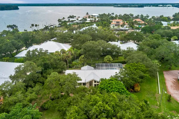 an aerial view of a house with a yard