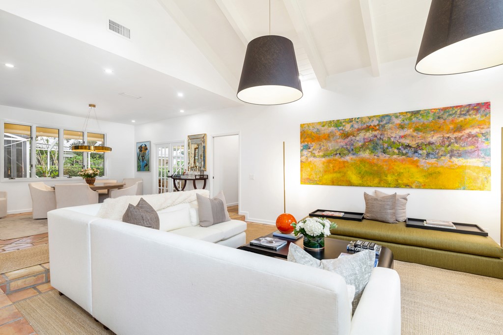 1513 East Camino Del Rio Vero Beach, FL 32963 - Photo 5 of 36 a living room with furniture and a large window