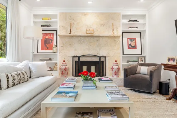 a living room with furniture and a fireplace