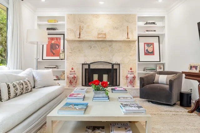 a living room with furniture and a fireplace