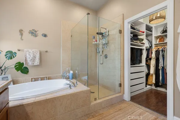 a bathroom with a bathtub and a shower