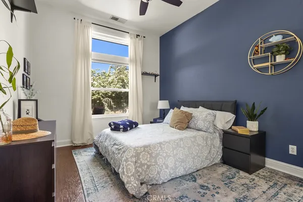 a bedroom with a bed and a window