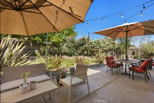 a view of a backyard with sitting area