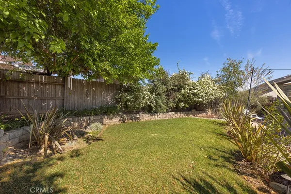 a view of a backyard with a patio