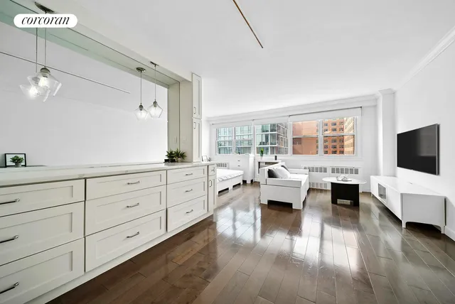 a view of a kitchen with wooden floor and a sink