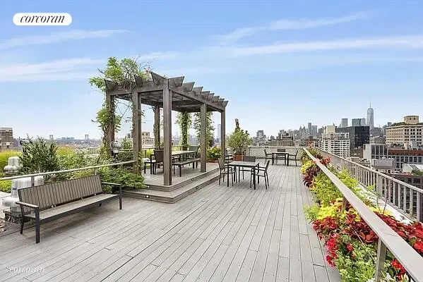 a view of a kitchen with wooden floor and a sink