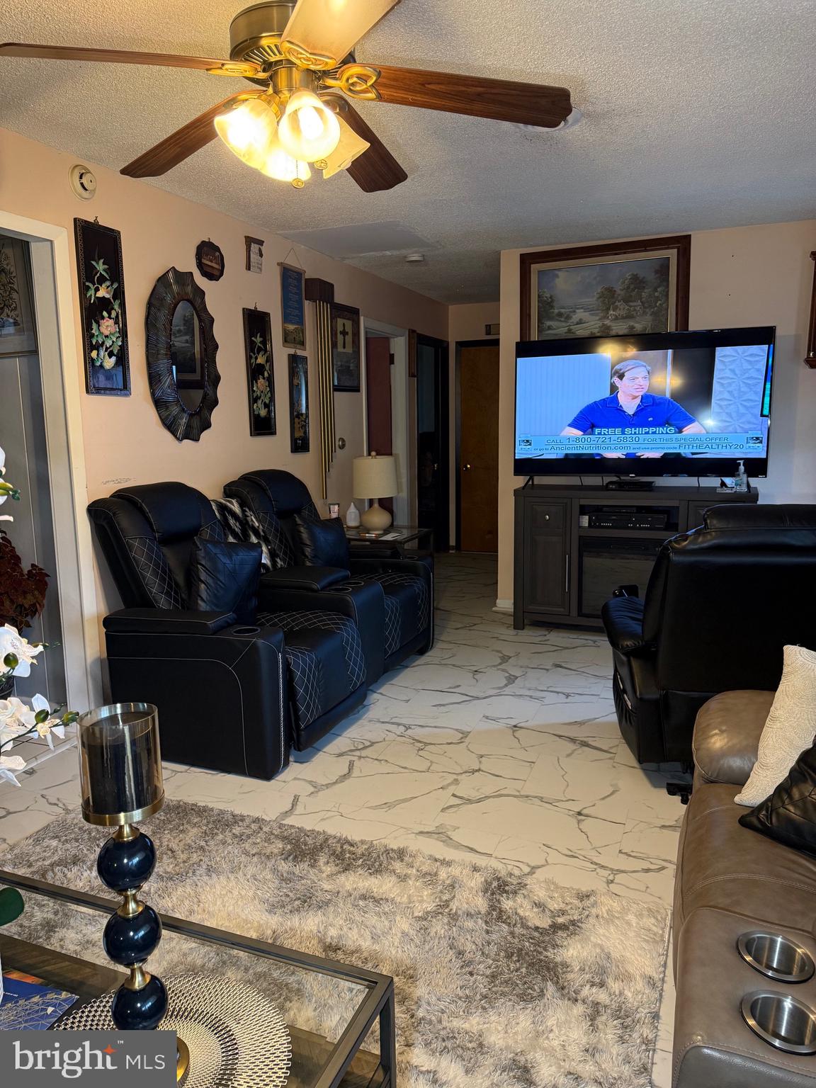 1339 Monmouth Road Mount Holly, NJ 08060 - Photo 11 of 34 a living room with furniture and a flat screen tv