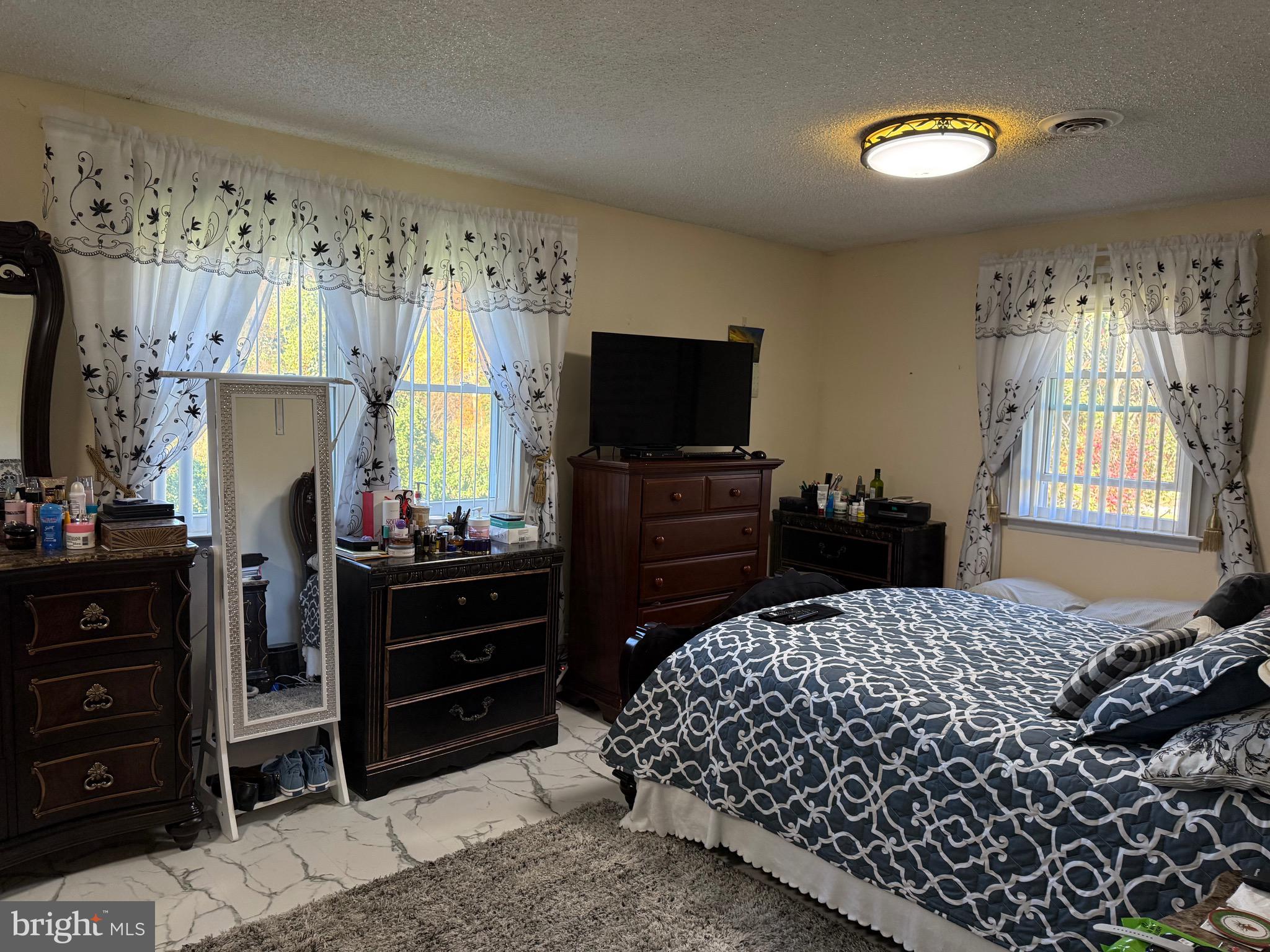 1339 Monmouth Road Mount Holly, NJ 08060 - Photo 18 of 34 a bedroom with a bed and a television