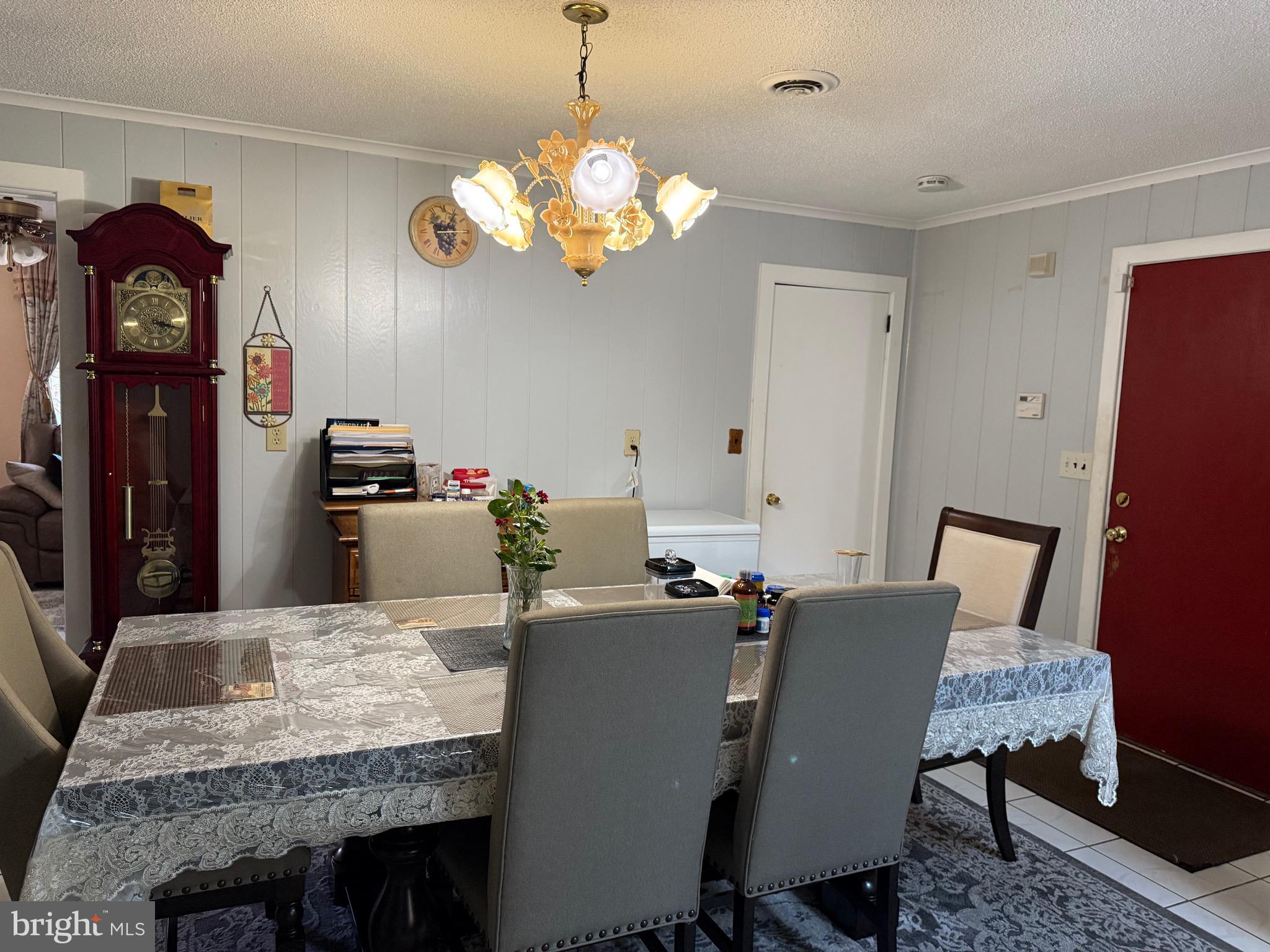 1339 Monmouth Road Mount Holly, NJ 08060 - Photo 24 of 34 a view of a dining room with furniture and chandelier