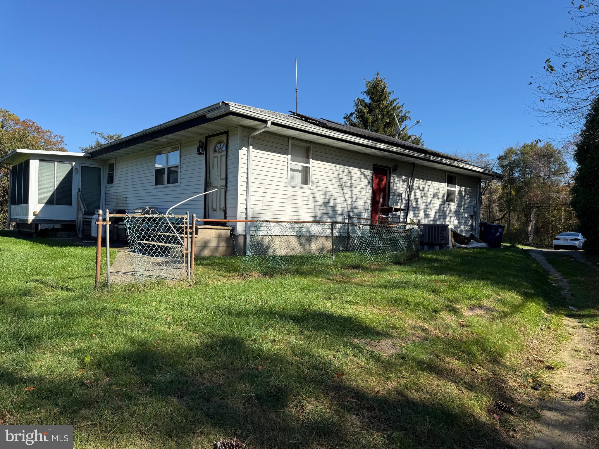 1339 Monmouth Road Mount Holly, NJ 08060 - Photo 7 of 34 a view of a house with a backyard