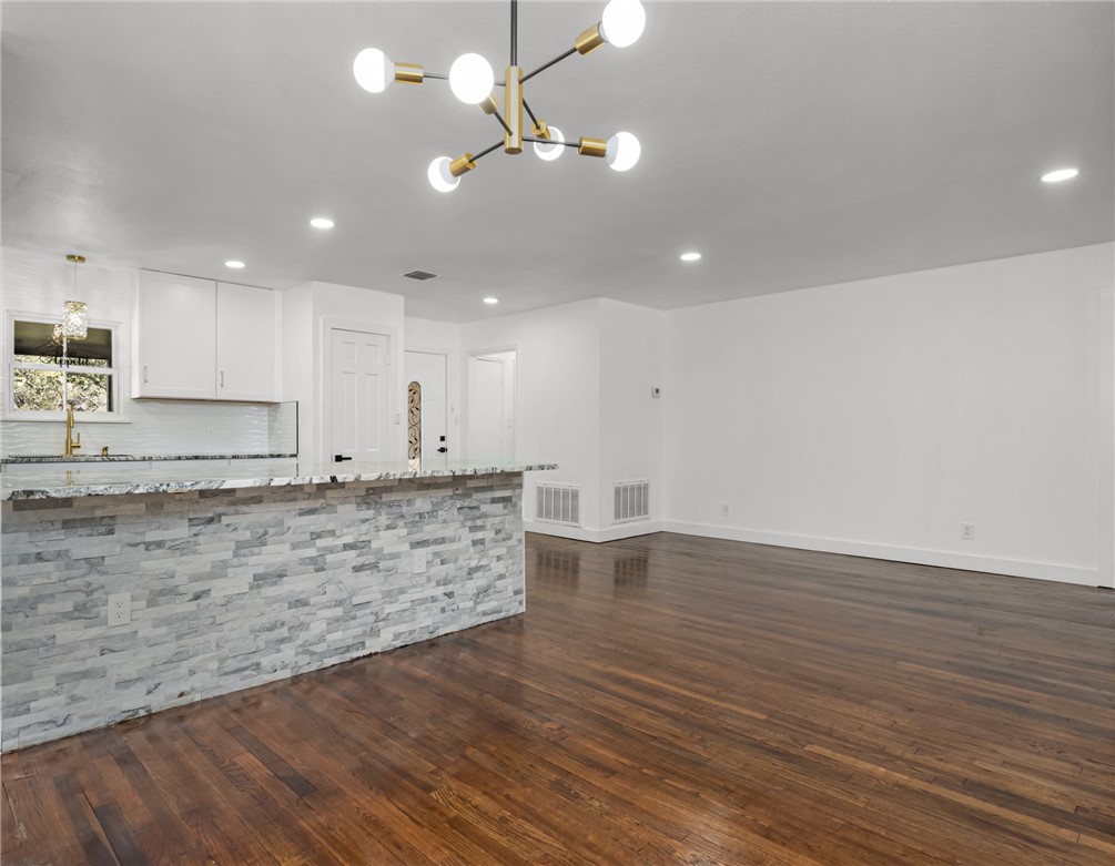 1012 East Main Street Sinton, TX 78387 - Photo 7 of 34 a view of kitchen with granite countertop window and wooden floor