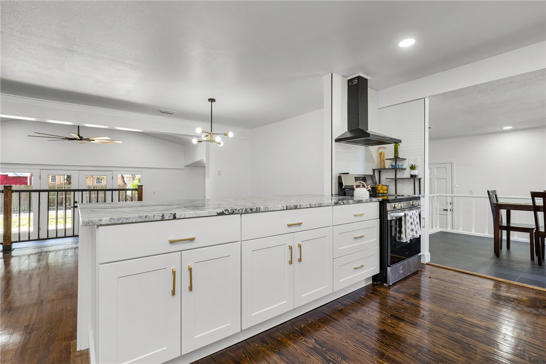 1012 East Main Street Sinton, TX 78387 - Photo 8 of 34 a kitchen with white cabinets and sink