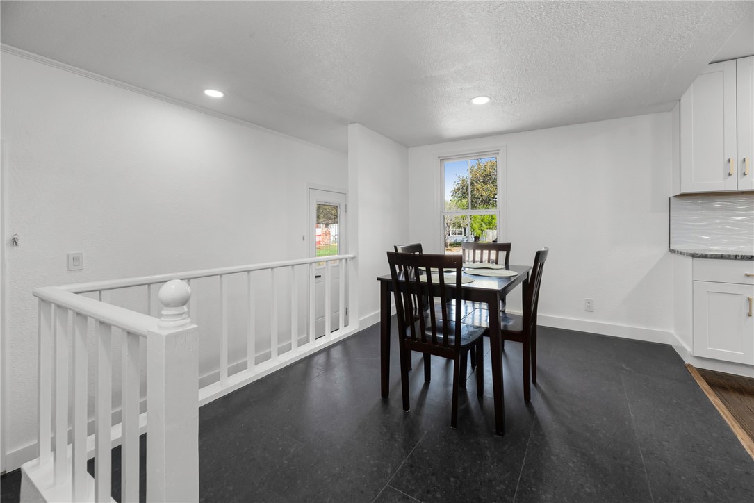 1012 East Main Street Sinton, TX 78387 - Photo 10 of 34 a view of a dining room with furniture and wooden floor