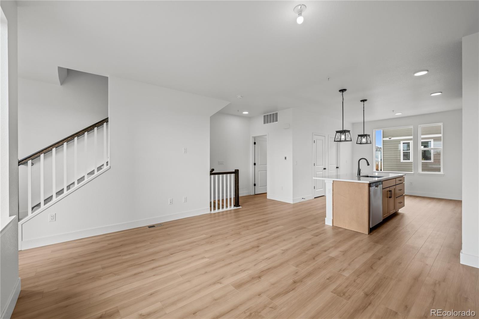 2736 West 68th Avenue Denver, CO 80221 - Photo 11 of 44 a view of kitchen with sink and wooden floor