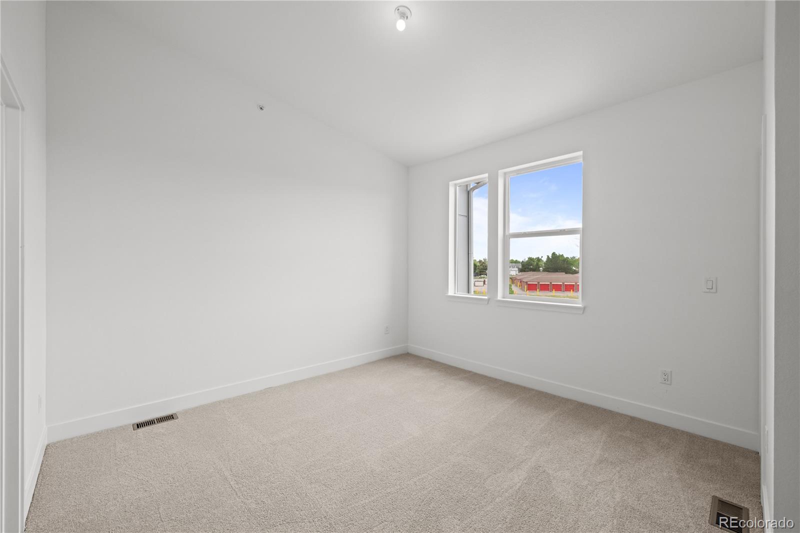 2736 West 68th Avenue Denver, CO 80221 - Photo 23 of 44 an empty room with windows