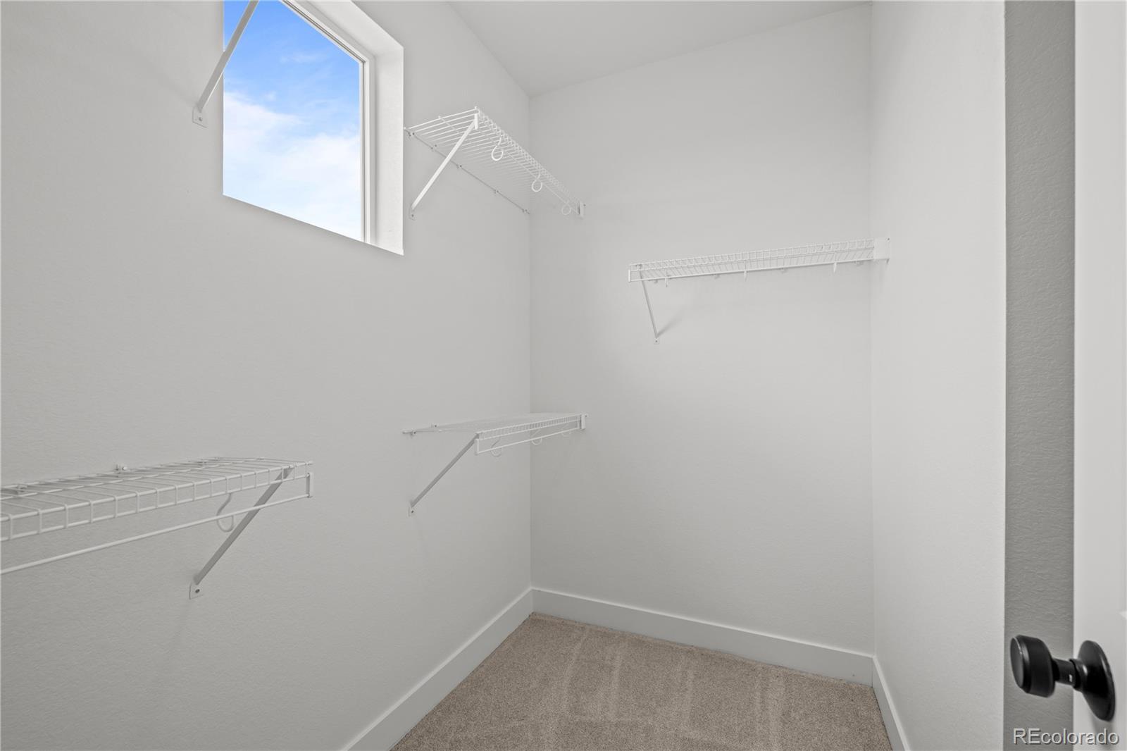 2736 West 68th Avenue Denver, CO 80221 - Photo 25 of 44 a view of a room with racks on the wall