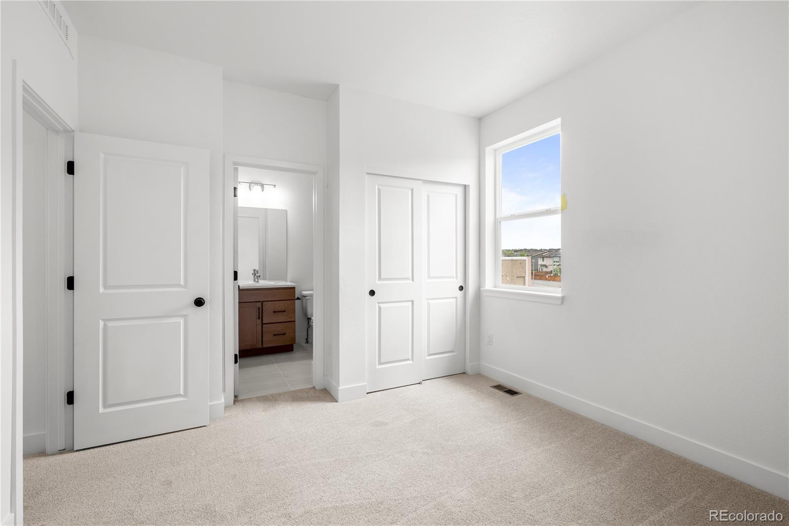 2736 West 68th Avenue Denver, CO 80221 - Photo 31 of 44 an empty room with windows and closet