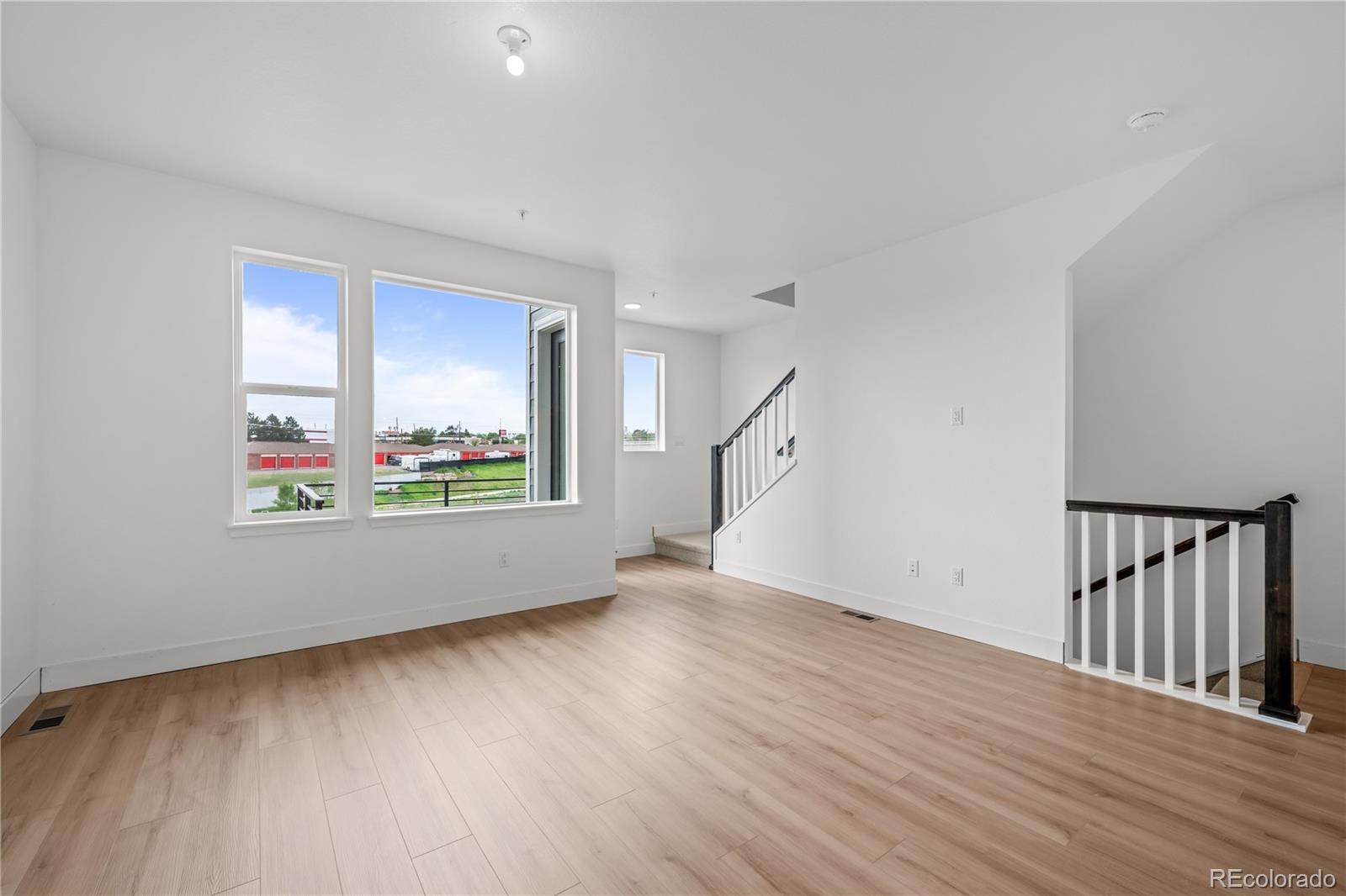 2736 West 68th Avenue Denver, CO 80221 - Photo 10 of 44 wooden floor in an empty room with a window