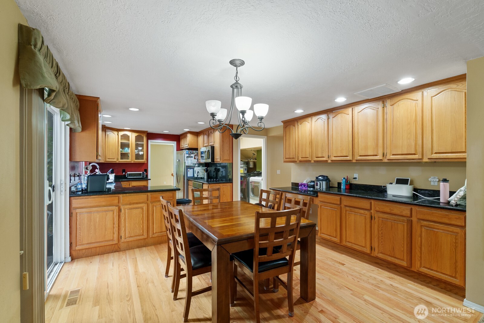 32738 6th Avenue Southwest Federal Way, WA 98023 - Photo 11 of 40 a kitchen with kitchen island granite countertop a sink cabinets and stainless steel appliances