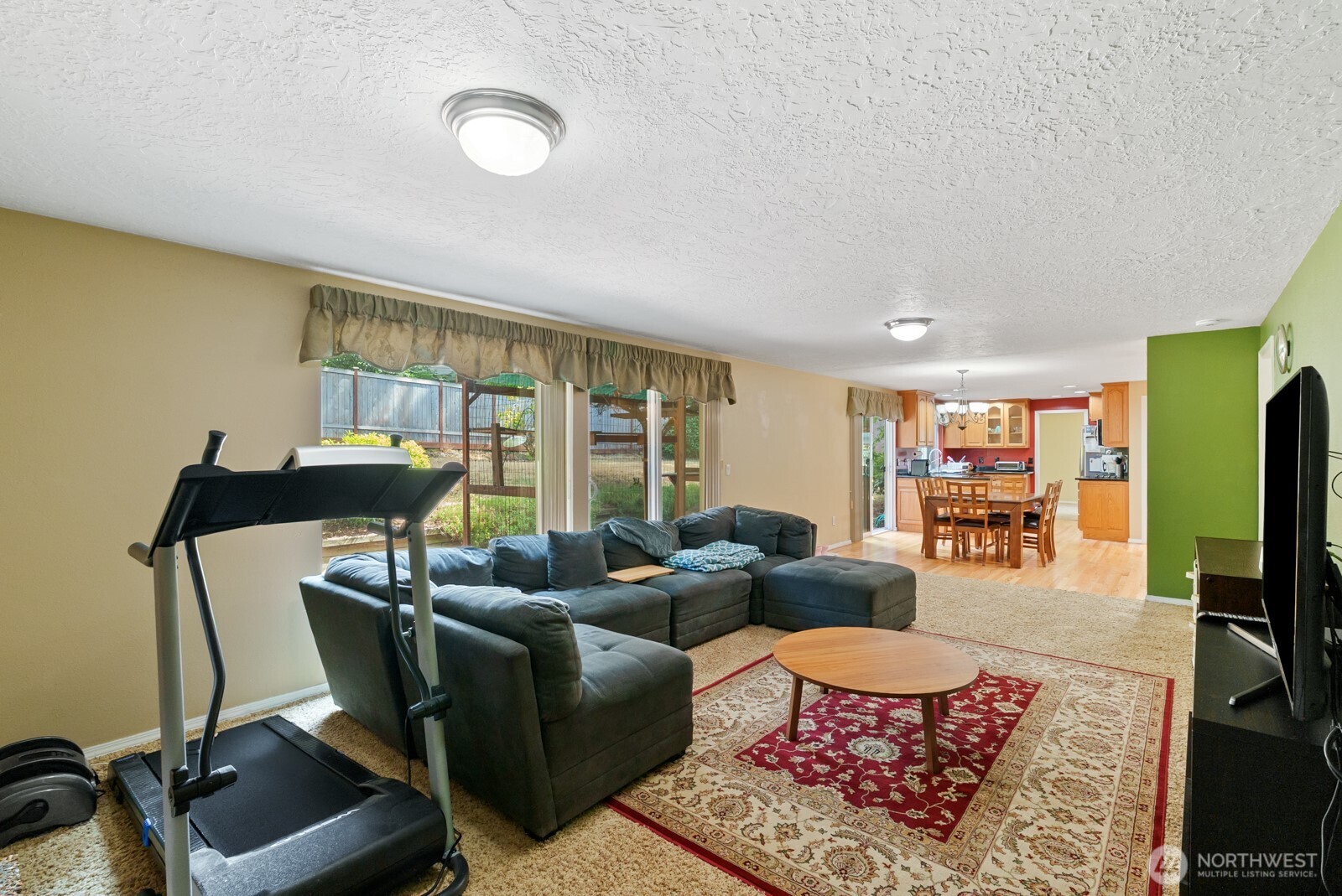 32738 6th Avenue Southwest Federal Way, WA 98023 - Photo 13 of 40 a living room with furniture a flat screen tv and a window