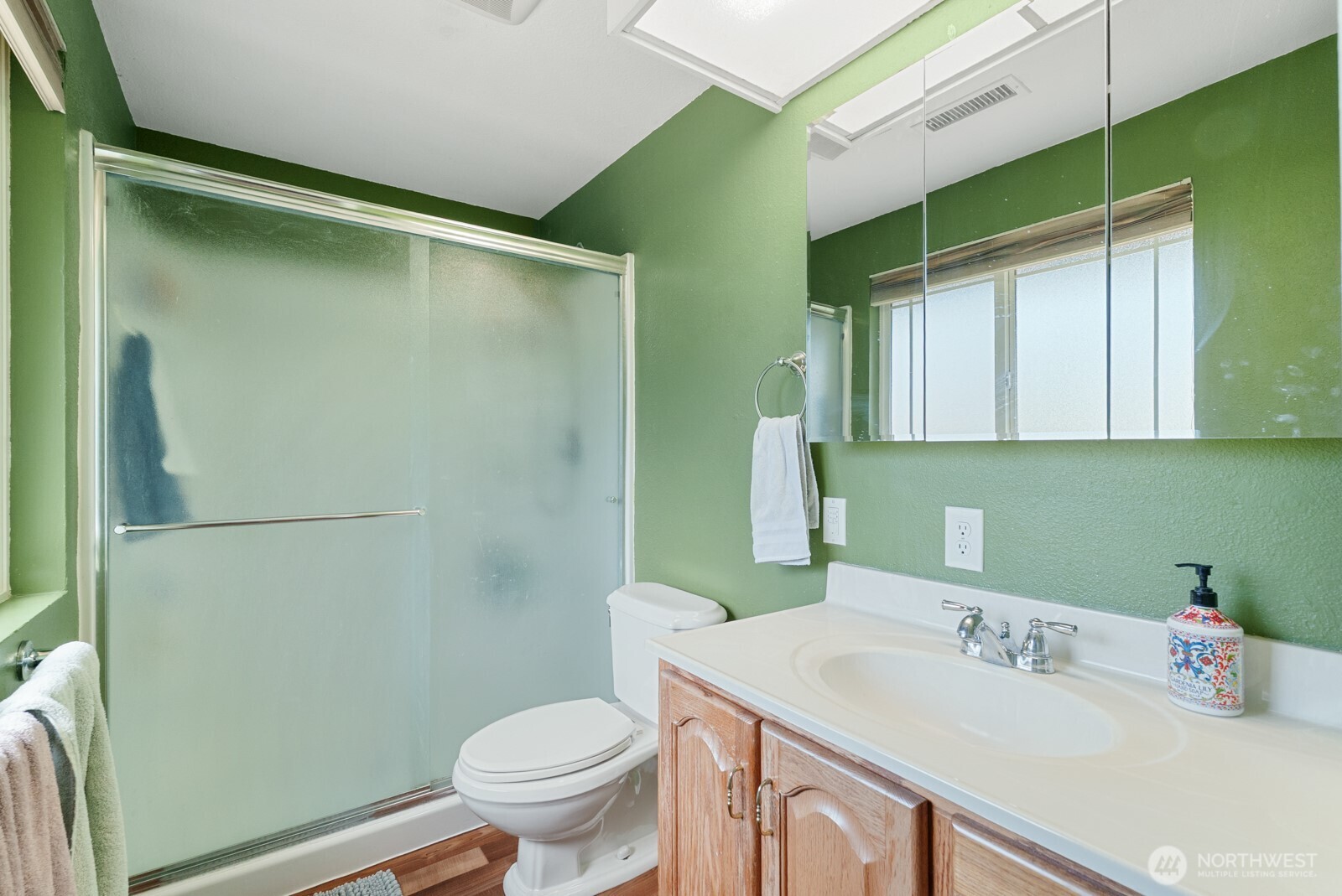 32738 6th Avenue Southwest Federal Way, WA 98023 - Photo 26 of 40 a bathroom with a sink a toilet and a mirror