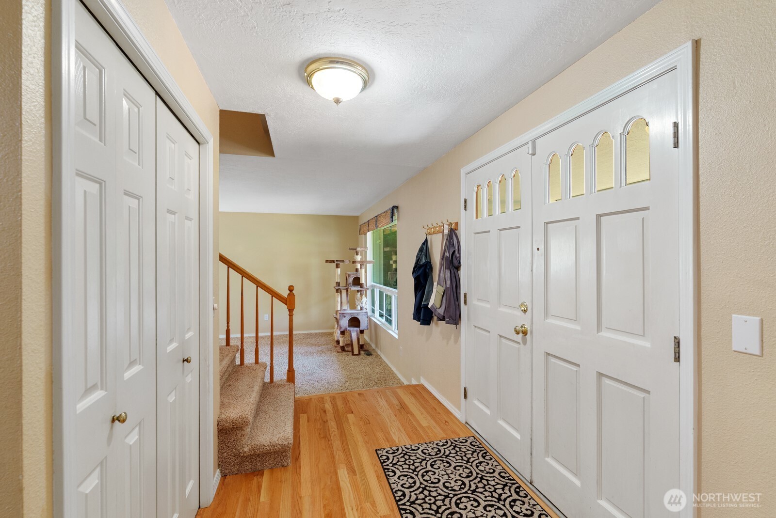 32738 6th Avenue Southwest Federal Way, WA 98023 - Photo 4 of 40 a view of a hallway with wooden floor and staircase