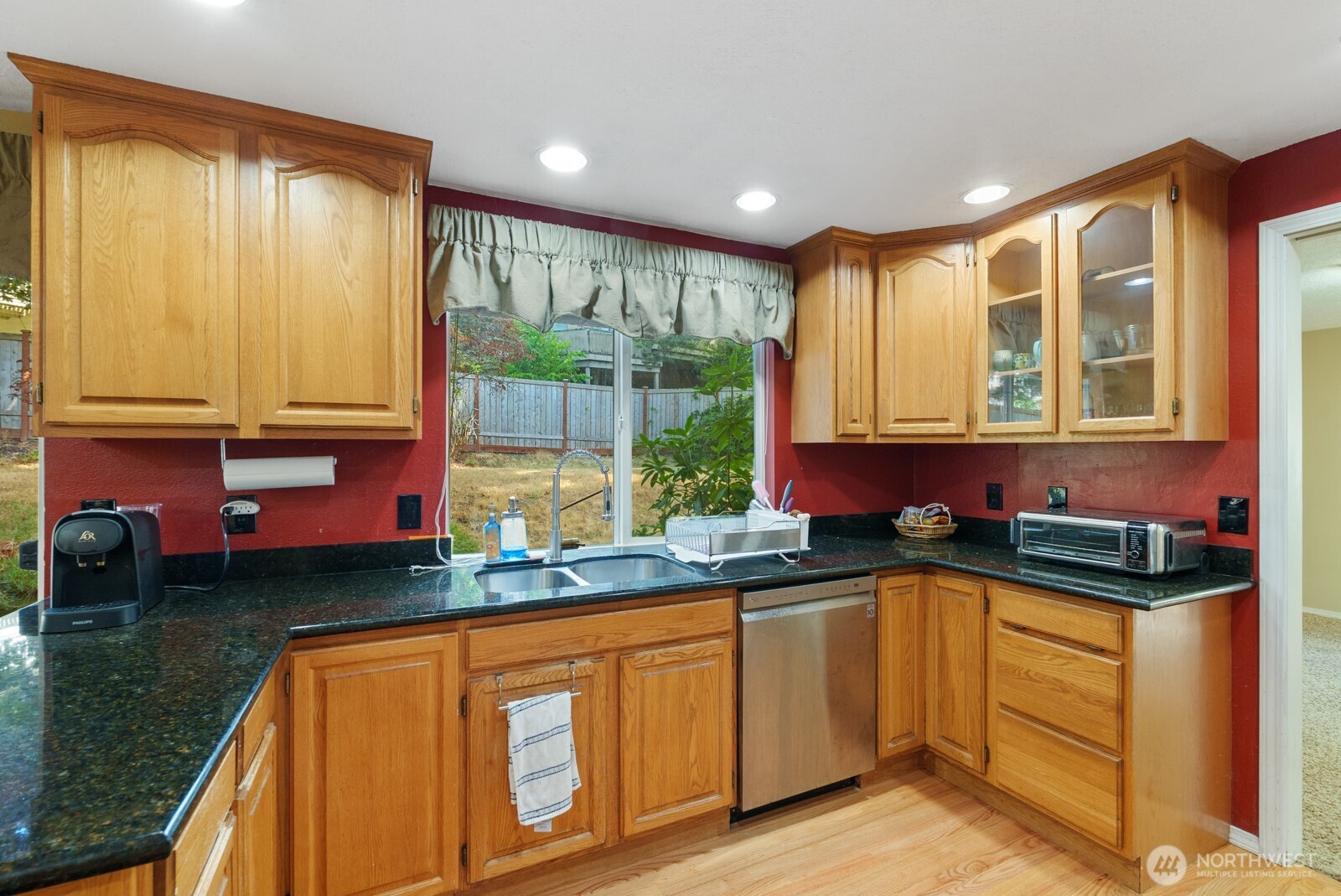 32738 6th Avenue Southwest Federal Way, WA 98023 - Photo 6 of 40 a kitchen with stainless steel appliances granite countertop a stove a sink and a microwave