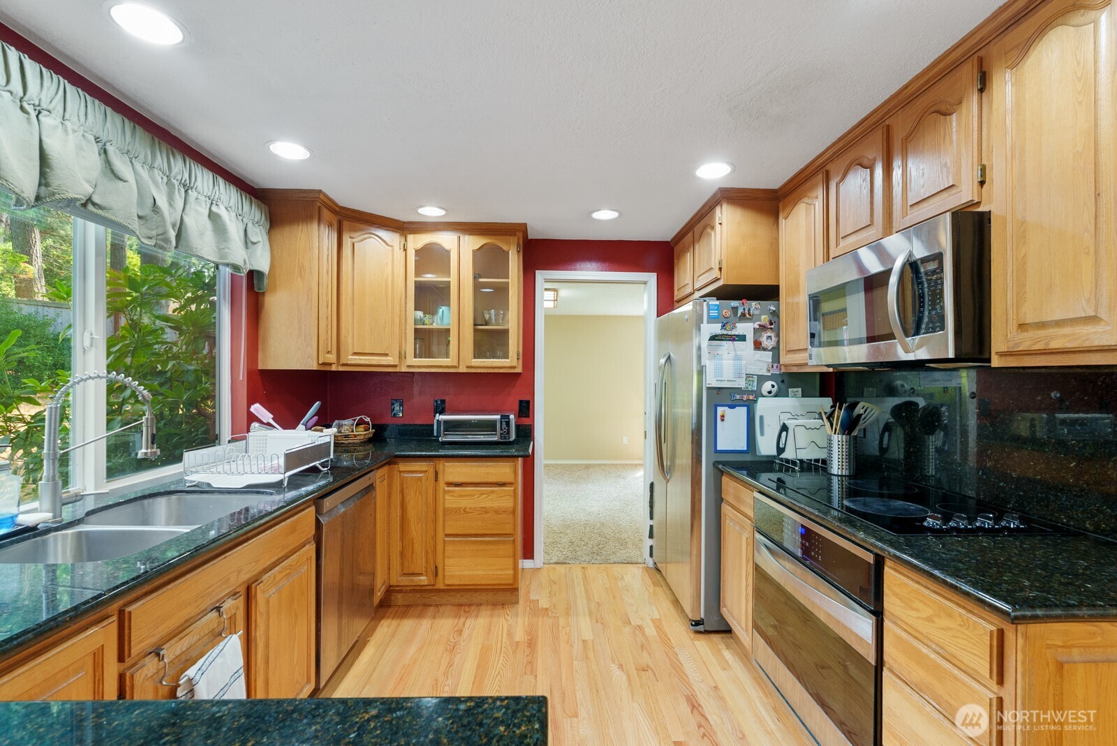 32738 6th Avenue Southwest Federal Way, WA 98023 - Photo 7 of 40 a kitchen with stainless steel appliances granite countertop a stove and cabinets