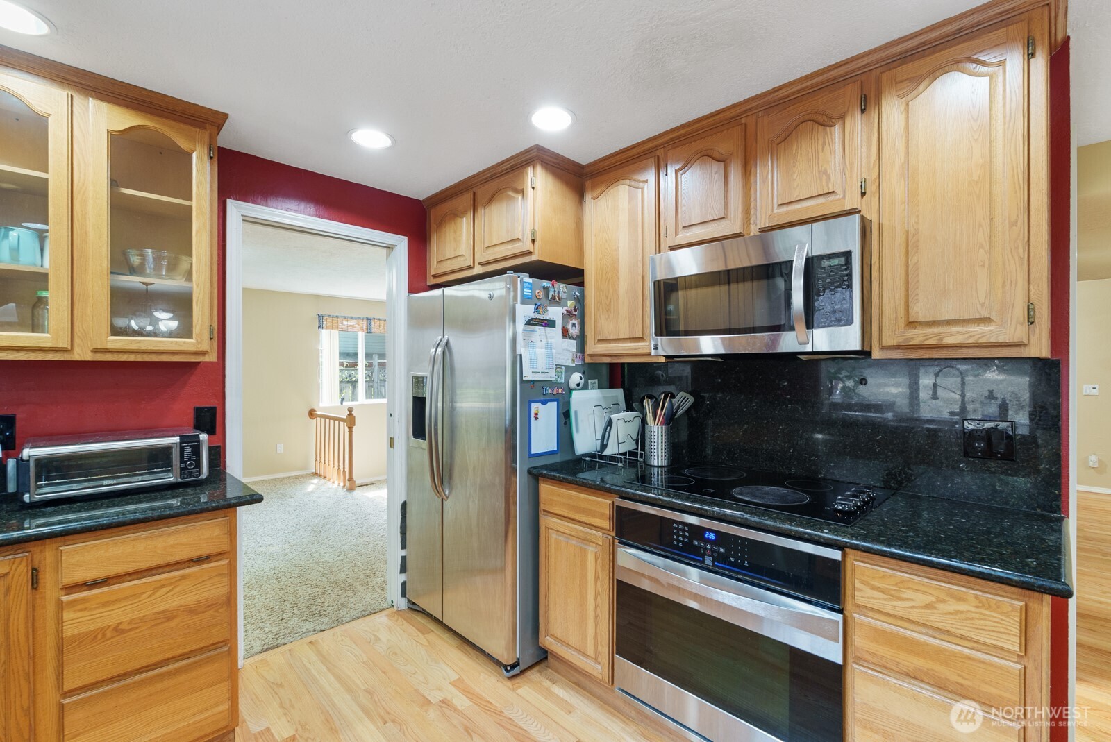 32738 6th Avenue Southwest Federal Way, WA 98023 - Photo 9 of 40 a kitchen with stainless steel appliances granite countertop a refrigerator and a stove top oven