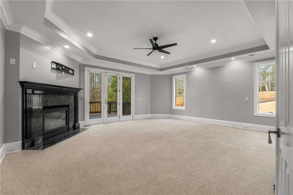 1483 Jones Road Roswell, GA 30075 - Photo 15 of 37 a view of an empty room with a fireplace and a window