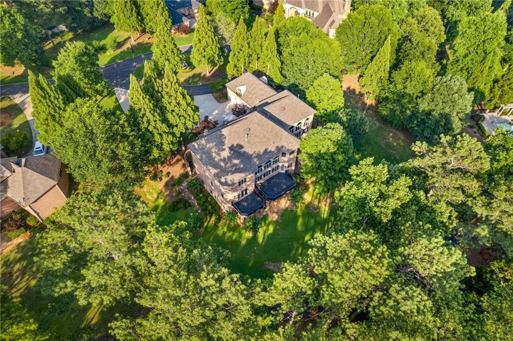 1483 Jones Road Roswell, GA 30075 - Photo 29 of 37 an aerial view of a house with a yard and garden