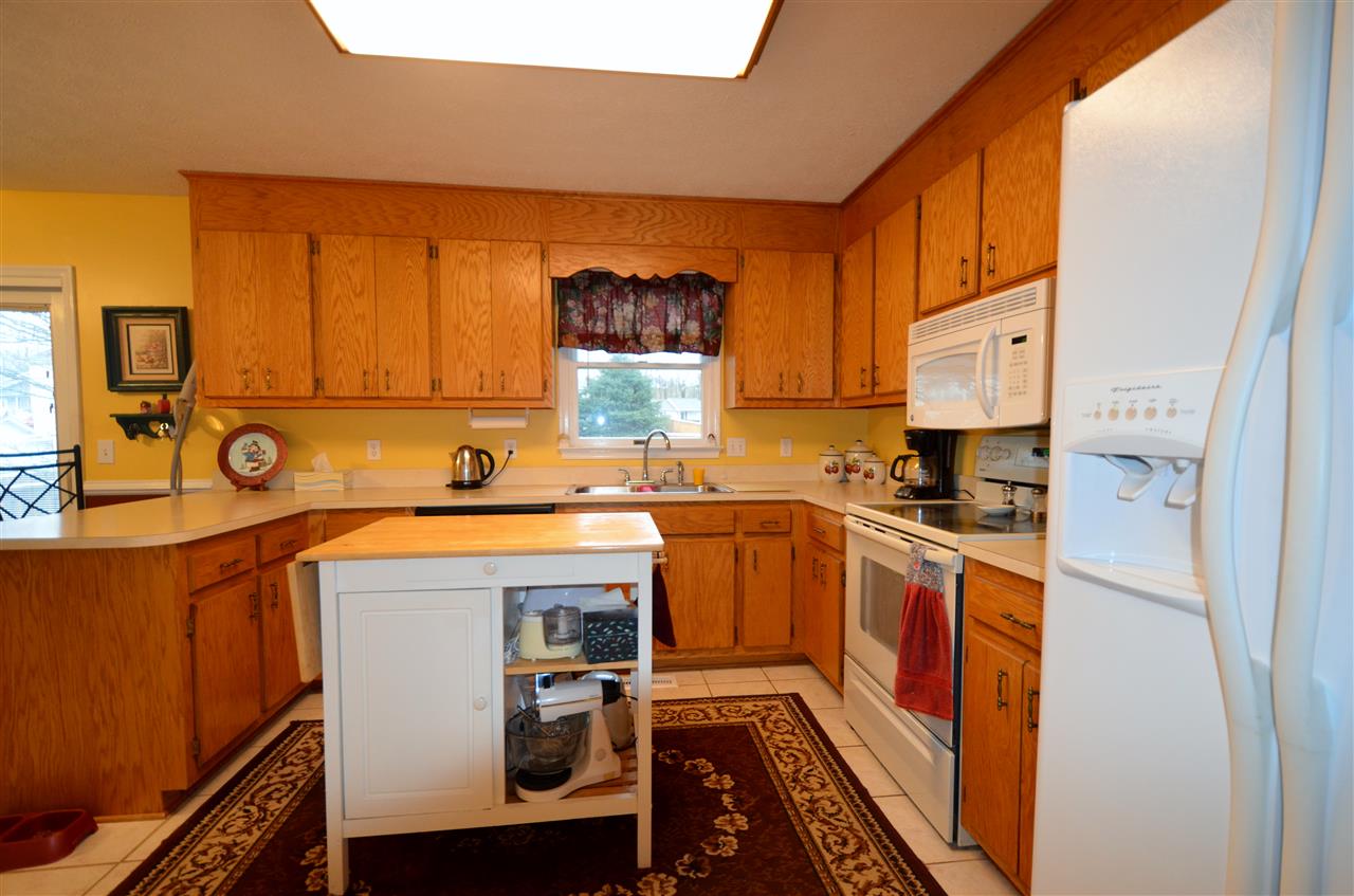 87 Ox Road Waynesboro, VA 22980 - Photo 7 of 25 a kitchen with stainless steel appliances a stove a sink and a refrigerator