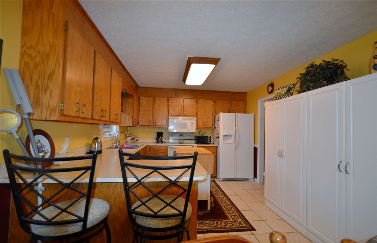 87 Ox Road Waynesboro, VA 22980 - Photo 8 of 25 a view of a kitchen with furniture and a refrigerator