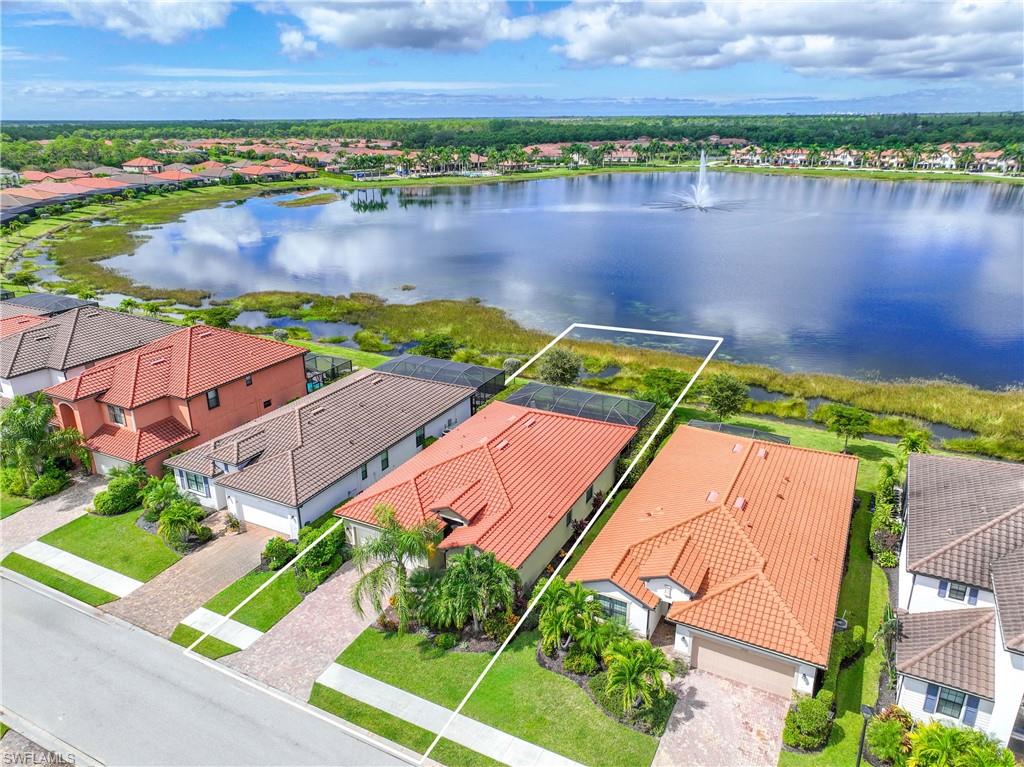 1602 Santiago Circle Naples, FL 34113 - Photo 3 of 49 Aerial perspective of suburban area with a large body of water