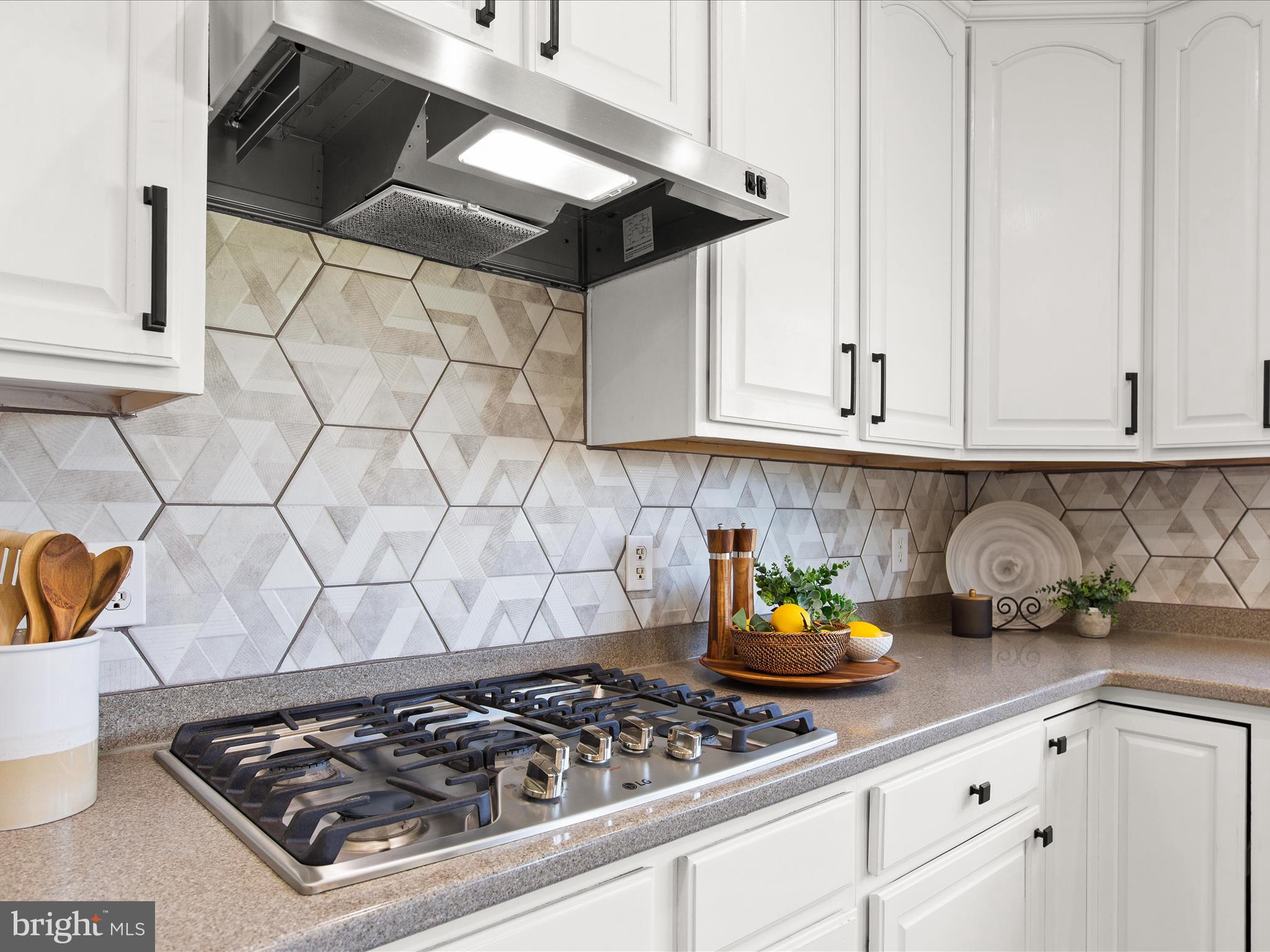 24757 Rivers Edge Road Millsboro, DE 19966 - Photo 24 of 61 Gas Cooktop and Range Hood