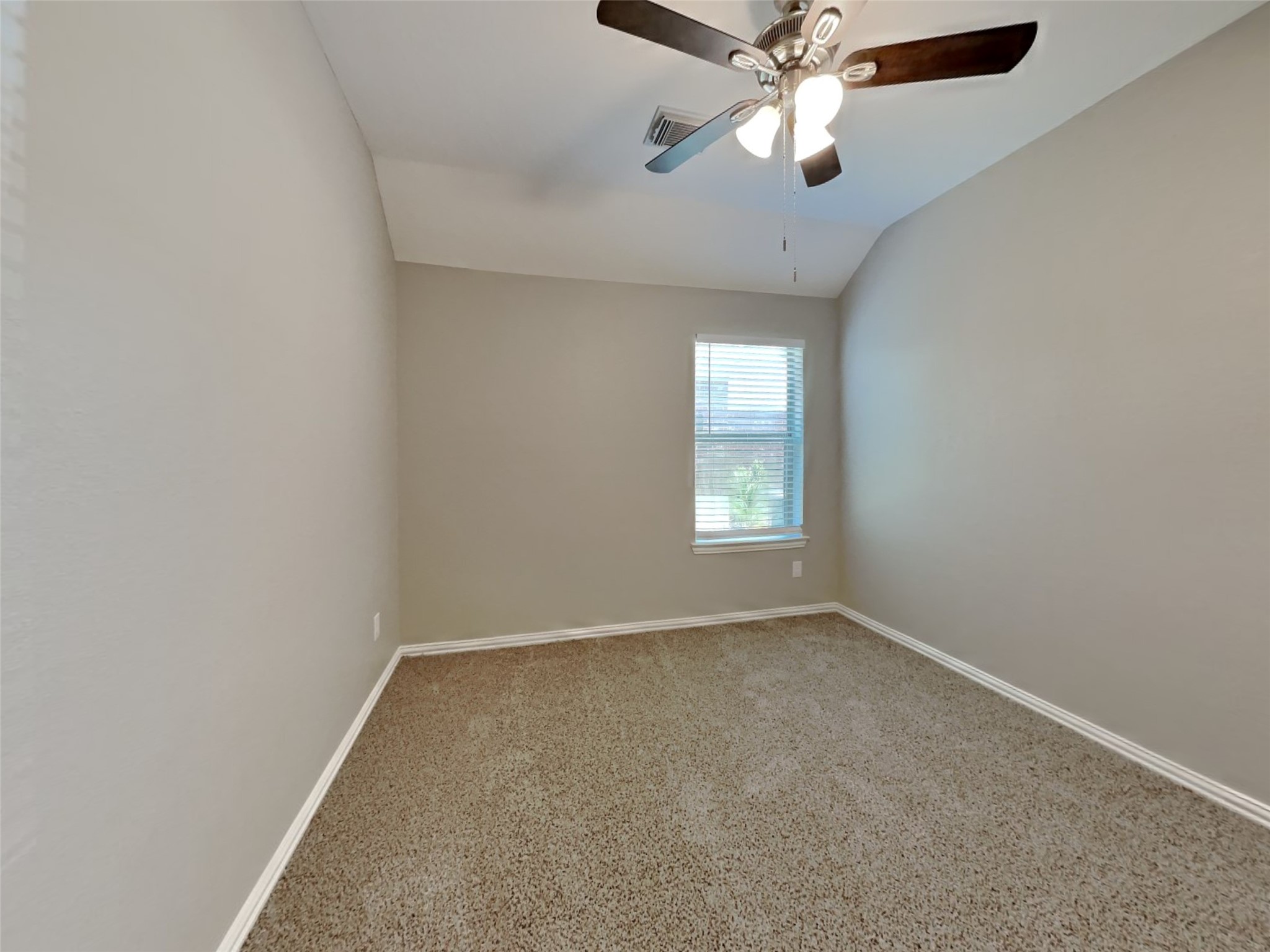 3007 Lockeridge Village Drive Spring, TX 77386 - Photo 14 of 18 an empty room with windows and fan