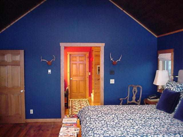 455 Mountain View Road Carbondale, CO 81623 - Photo 3 of 6 a bedroom with a bed and mirror