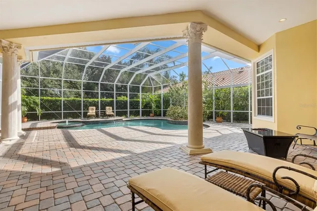 a view of a living room and floor to ceiling window