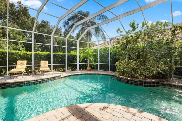 a view of a backyard with sitting area